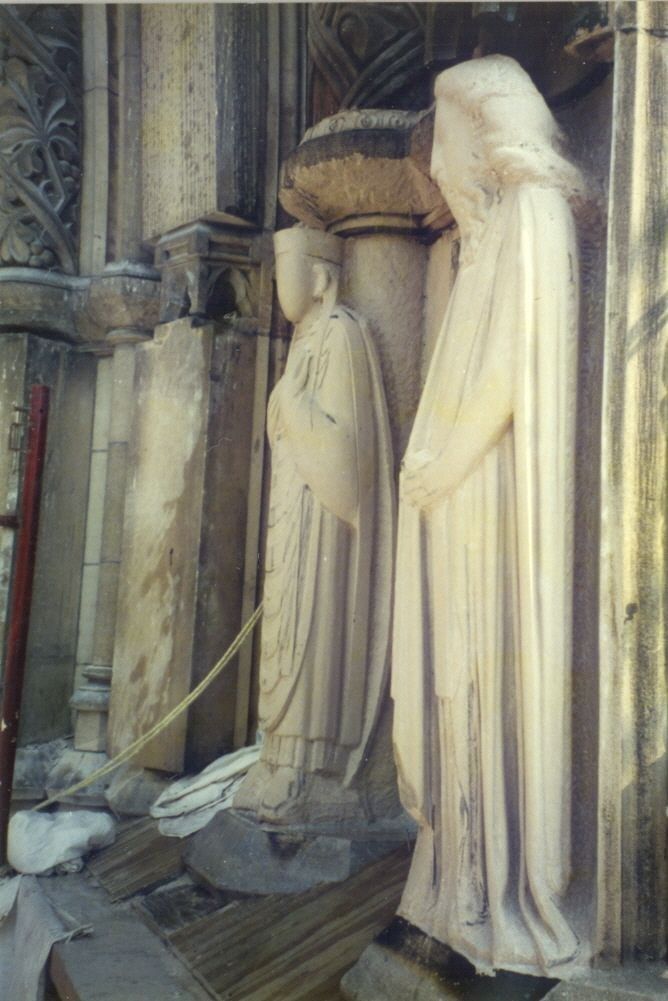 Progress photograph of the second tier carvings being shaped in stone.